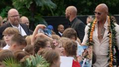 Source-feed image associated with School trip surprise as students meet The Rock