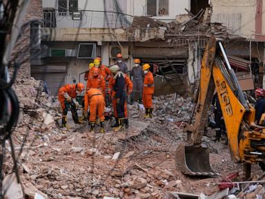 Source-feed image associated with Rescuers search for people trapped in New Delhi building collapse as death toll rises