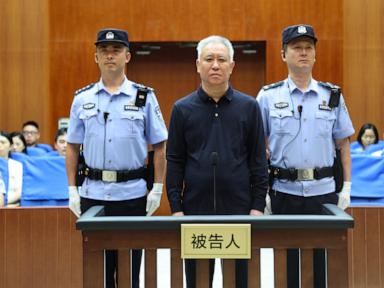 Source-feed image associated with Chinese court jails founder of troubled property developer Evergrande for life