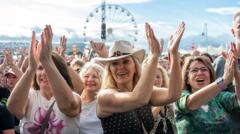 Source-feed image associated with In pictures: Thousands flock to Radio 2 in the Park in Stirling