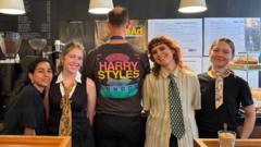 Source-feed image associated with Harry Styles funds free coffee at two London cafes