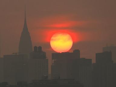 Source-feed image associated with Toxic wildfire smoke chokes major US cities: Latest