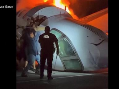 Source-feed image associated with WATCH: Good Samaritans race towards fiery plane on Texas highway to rescue survivors