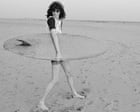 Source-feed image associated with Joey Ramone smiling! And having fun! At the beach! Roberta Bayley’s best photograph