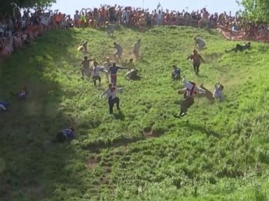Source-feed image associated with WATCH: Big winners at Britain's annual cheese-rolling competition