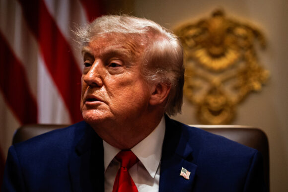 Source-feed image associated with Trump Takes Hands-Off Approach to AI Cybersecurity in New Order