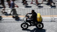 Source-feed image associated with Heatwave prompts Italy's delivery riders to strike for extra rights