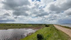 Source-feed image associated with Failing sea defences 'disaster' for nature reserve