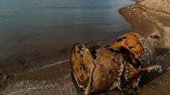 Image from linked report: US police identify remains of man found in barrel in shrinking reservoir