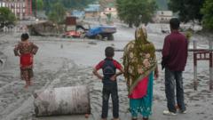 Source-feed image associated with King 'heartbroken' by deadly Nepal flash floods