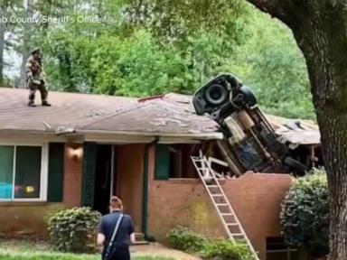 Source-feed image associated with WATCH: Car lands on Georgia home in deadly crash