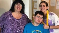 Source-feed image associated with 'He was a lifeline' - Families at a loss after Haitian caregivers let go in US
