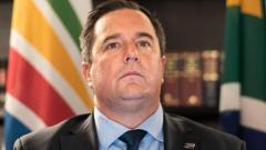 Source-feed image associated with Leader of South Africa's second biggest party wants his predecessor sacked as minister