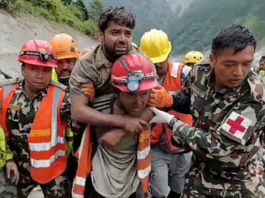 Source-feed image associated with 2 people rescued alive from tunnel after deadly Nepal-Tibet flash flood