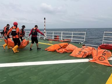 Image from linked report: Divers recover a total of 52 bodies from capsized ferry in Indonesia after a dayslong search