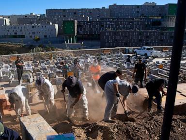 Source-feed image associated with Burials begin for migrants who died attempting to cross into the Spanish territory