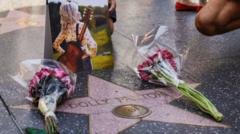 Source-feed image associated with Dolly Parton gets new star on Hollywood Walk of Fame after vandalism