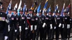 Source-feed image associated with Police and army attend funeral for officer killed in wrong-way A66 crash