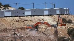 Source-feed image associated with UK government expected to announce restrictions on trade with West Bank settlements