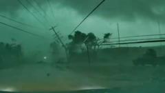 Source-feed image associated with Dashcam captures tornado toppling power lines onto car