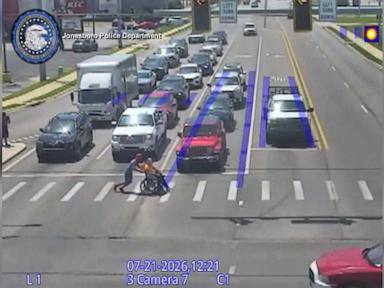Source-feed image associated with WATCH: Real-life Spider-Man has superhero moment caught on traffic camera
