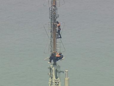 Source-feed image associated with Empire State Building climbers released from jail after court appearance