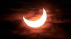 Source-feed image associated with UK to get best eclipse since 1999 as Moon blocks out Sun across Europe
