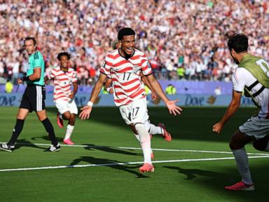 Source-feed image associated with US defeats Bosnia-Herzegovina 2-0, advancing to World Cup round of 16