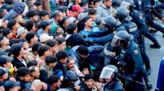 Source-feed image associated with Police begin operation to move migrants from Ceuta beaches