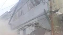 Source-feed image associated with Chaos after building collapses on Caracas outskirts
