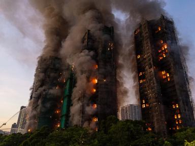 Source-feed image associated with Hong Kong charges 7 people and 2 firms over massive fire that killed 168