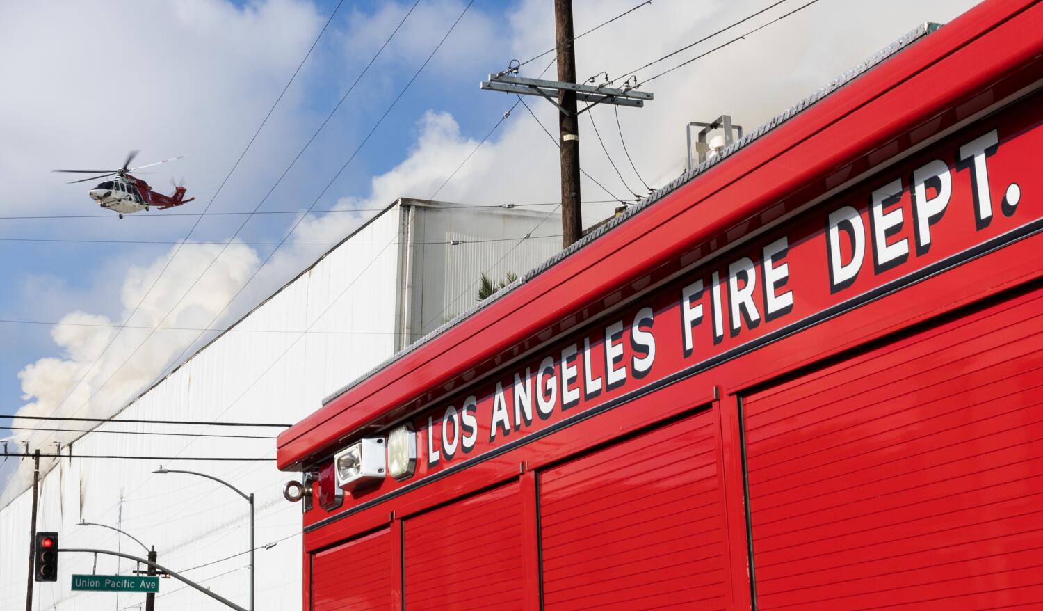 Source-feed image associated with Newsom and L.A. declare state of emergency as Boyle Heights fire continues spewing smoke across region