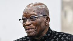 Source-feed image associated with Zuma showing South Africa 'middle finger' by meeting Gupta brother - minister