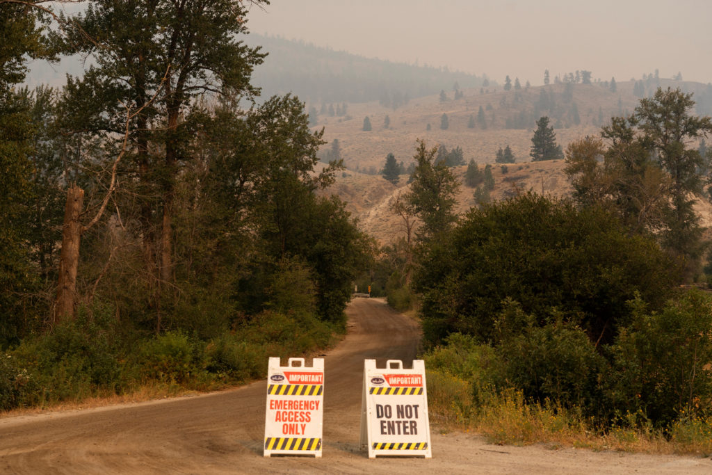 Source-feed image associated with Thousands evacuated as wildfires burn across western U.S. and Canada