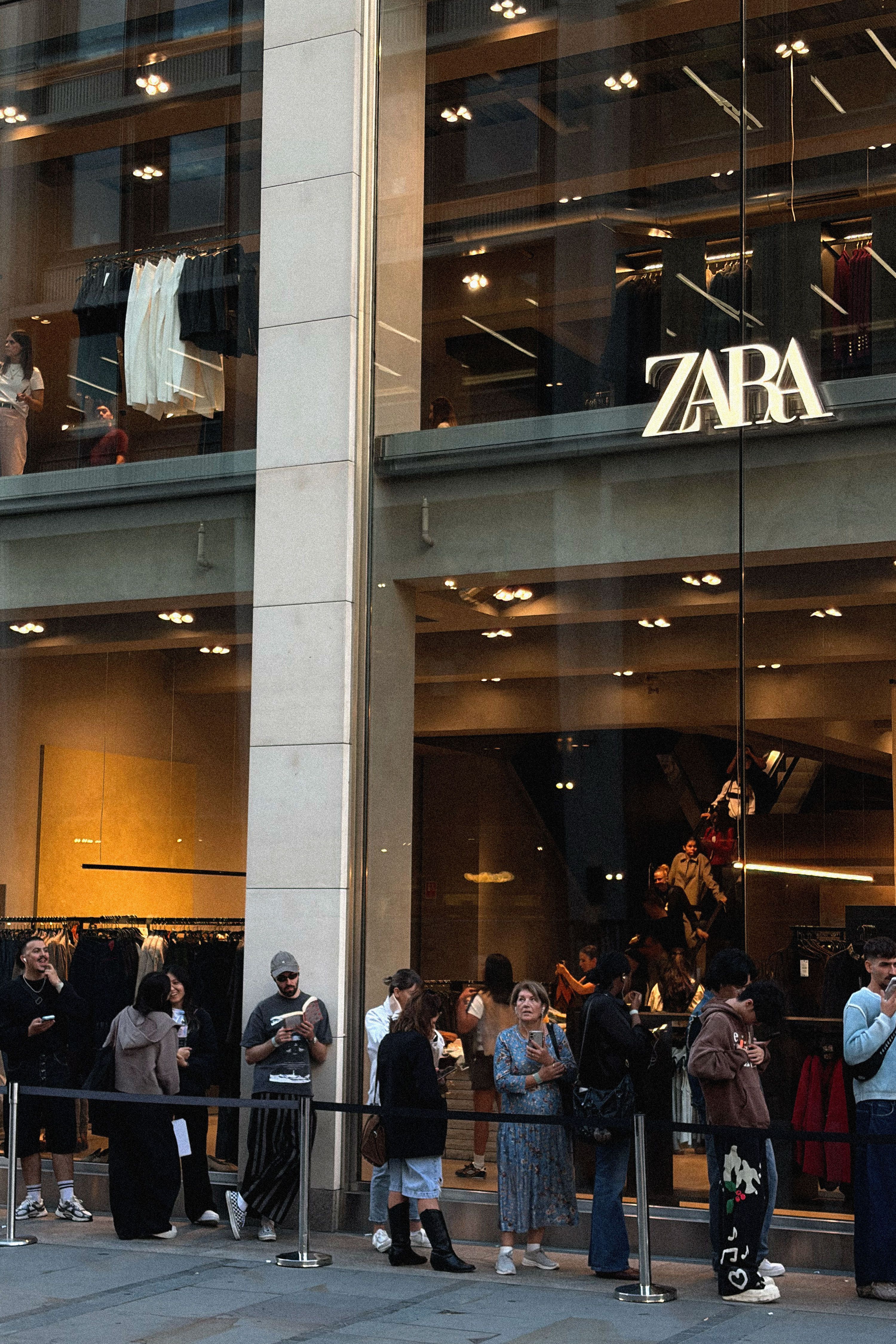 Image from linked report: In the Queue for John Galliano’s Zara