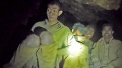 Source-feed image associated with Watch: Moment rescuers find five people trapped in Laos cave for a week