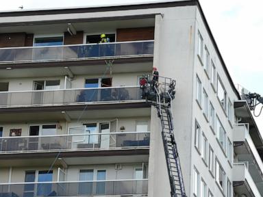 Source-feed image associated with Fire in Belgian apartment block leaves at least 6 people dead, many injured