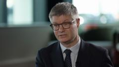 Source-feed image associated with Next boss warns of 'dramatic' fall in entry-level jobs