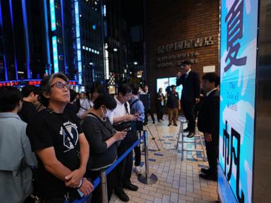 Source-feed image associated with Fans mark the release of new Haruki Murakami novel at a midnight event in Tokyo