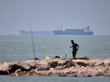 Source-feed image associated with Iranian drones attack Bahrain and a ship is struck in the strait after US airstrikes