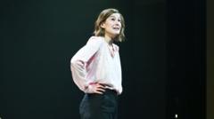 Source-feed image associated with Rosamund Pike calls out audience member for texting during show