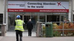 Source-feed image associated with Security staff strikes averted at Aberdeen Airport