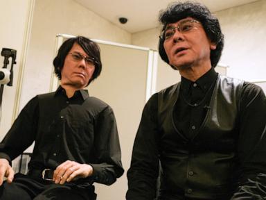 Source-feed image associated with Humanoids dance and thread needles as Japanese robotics developers look to outdo Chinese