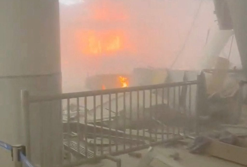 Source-feed image associated with Iran strikes Kuwait's main airport and kills 1 as ceasefire is tested again