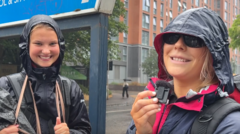 Source-feed image associated with Festivalgoers brave heavy rain on wet first day