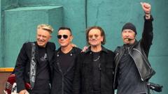 Image from linked report: U2 celebrate 50th anniversary at the school where they formed