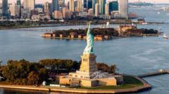 Source-feed image associated with Man arrested after boat capsizes near Statue of Liberty killing woman and infant