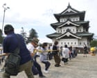 Source-feed image associated with Japan enlists 1,800 people to drag a 360-tonne castle keep using ropes and rollers