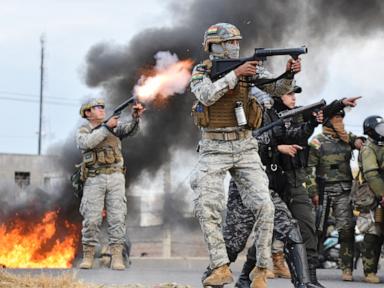 Source-feed image associated with Protesters, police clash in Bolivia after president signs law enabling a harsher crackdown