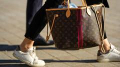 Source-feed image associated with A global hub for fake luxury goods, Vietnam cracks down on its black market